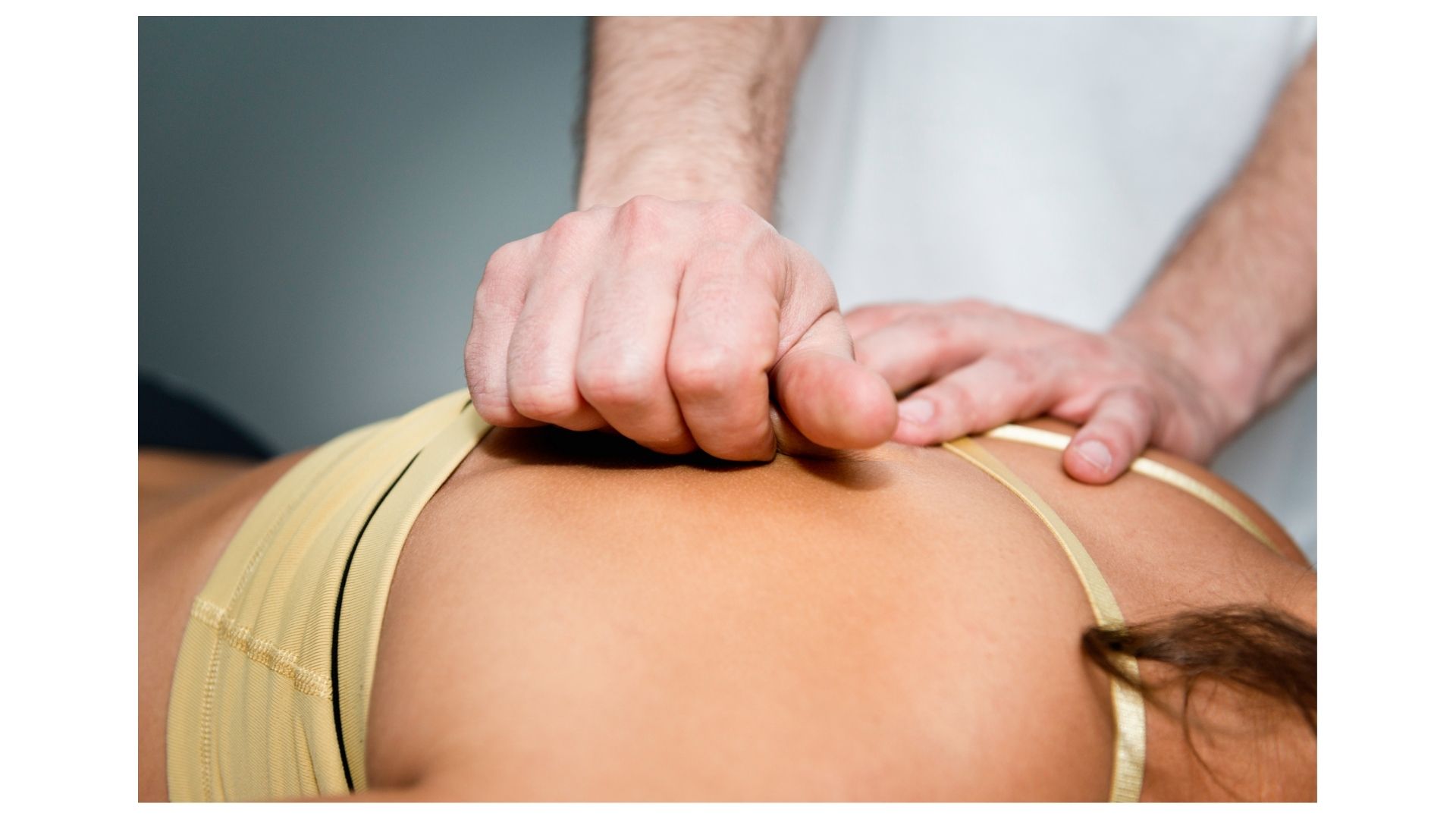 Myofascial release and trigger point therapy in Topeka KS — chiropractor applying focused pressure to relieve deep muscle tension at Thrive Chiropractic